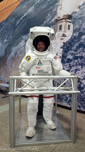 Heather Raulerson in a space suit at U.S. Space & Rocket Center