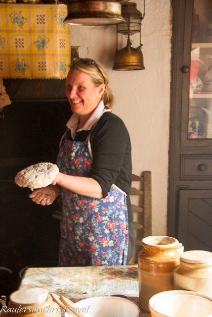 Frances showing off Soda Bread made by hand at Molly Gallivan's