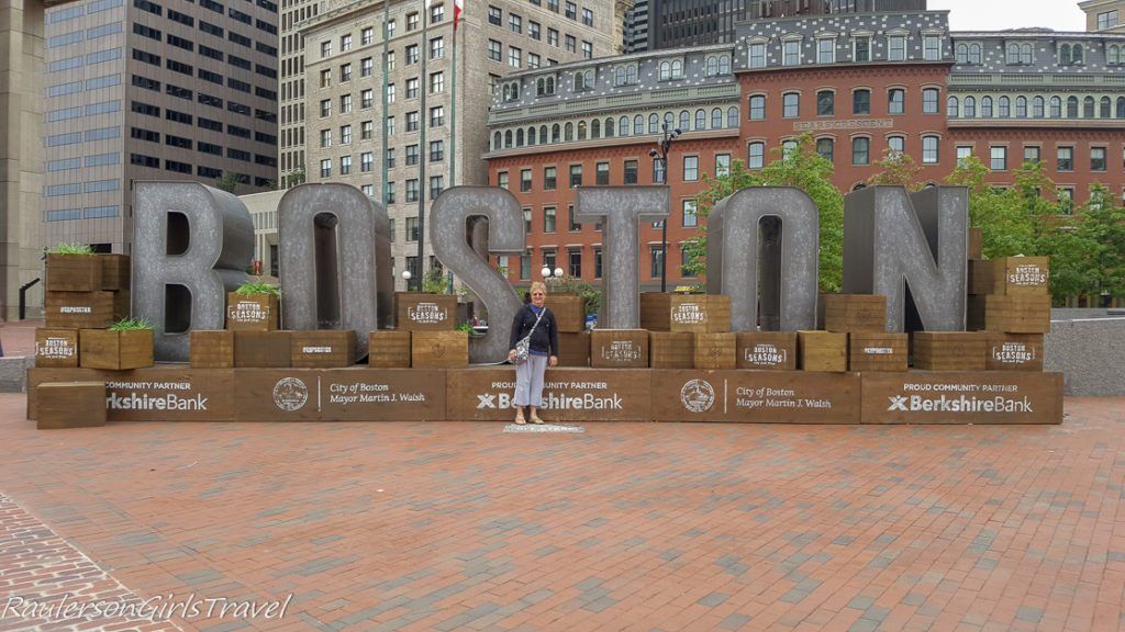 Loraine in front of Boston sign