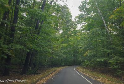 Driving along the road in Sleeping Bear Dunes National Park - Summer Road Trip Packing List
