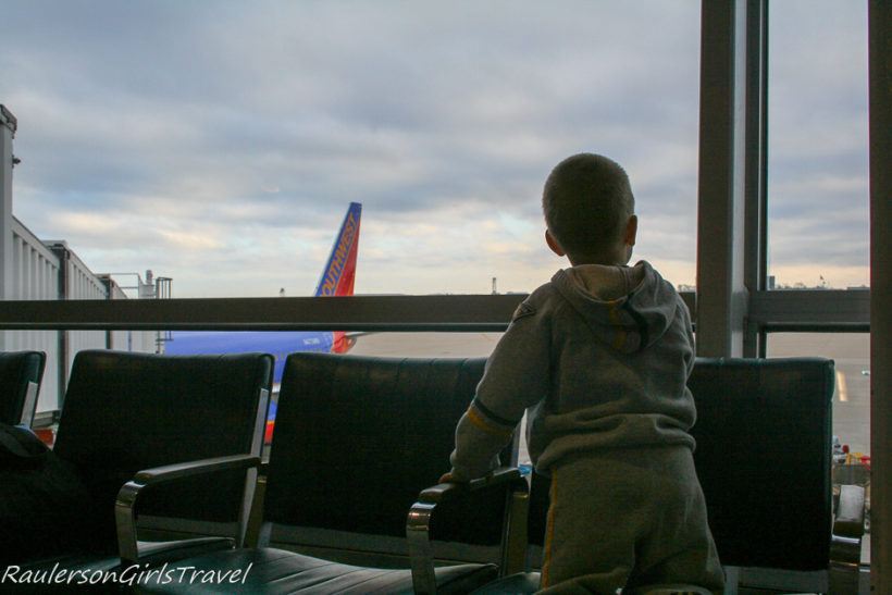 Alex watching the planes at the airport
