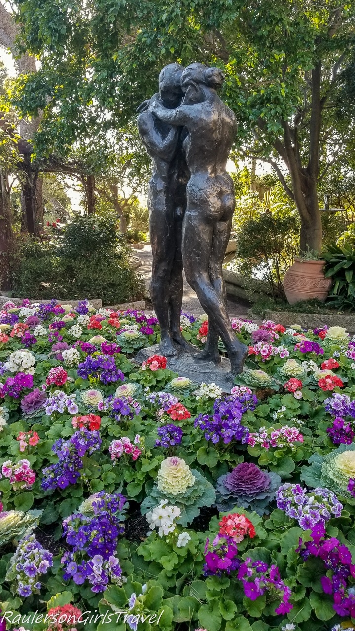 Lovers embracing in a bed of flowers