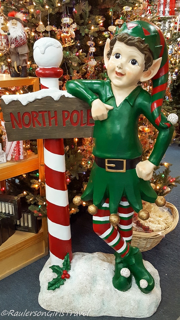 North Pole Elf by Christmas Tree