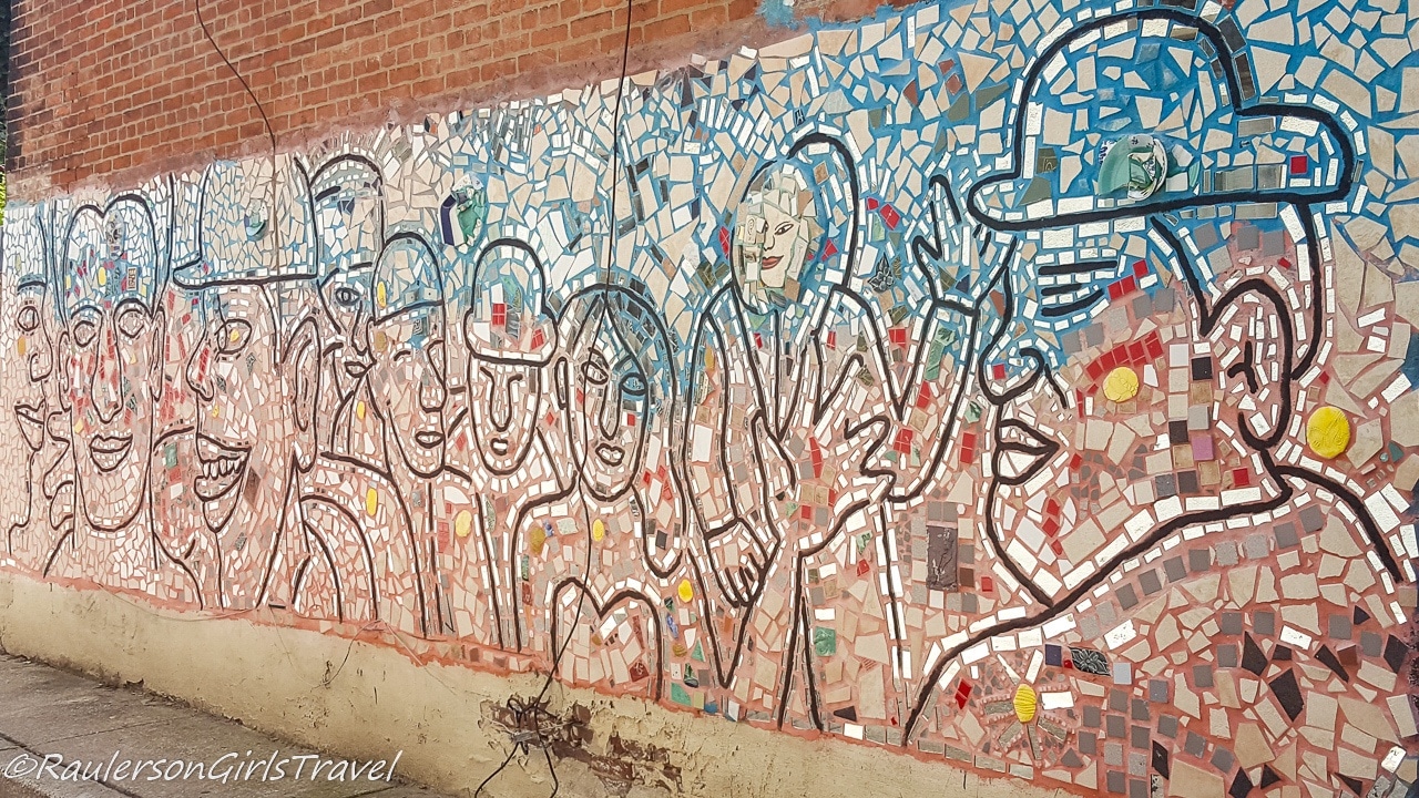 Tiled Mosaics of people on the side of Philadelphia
