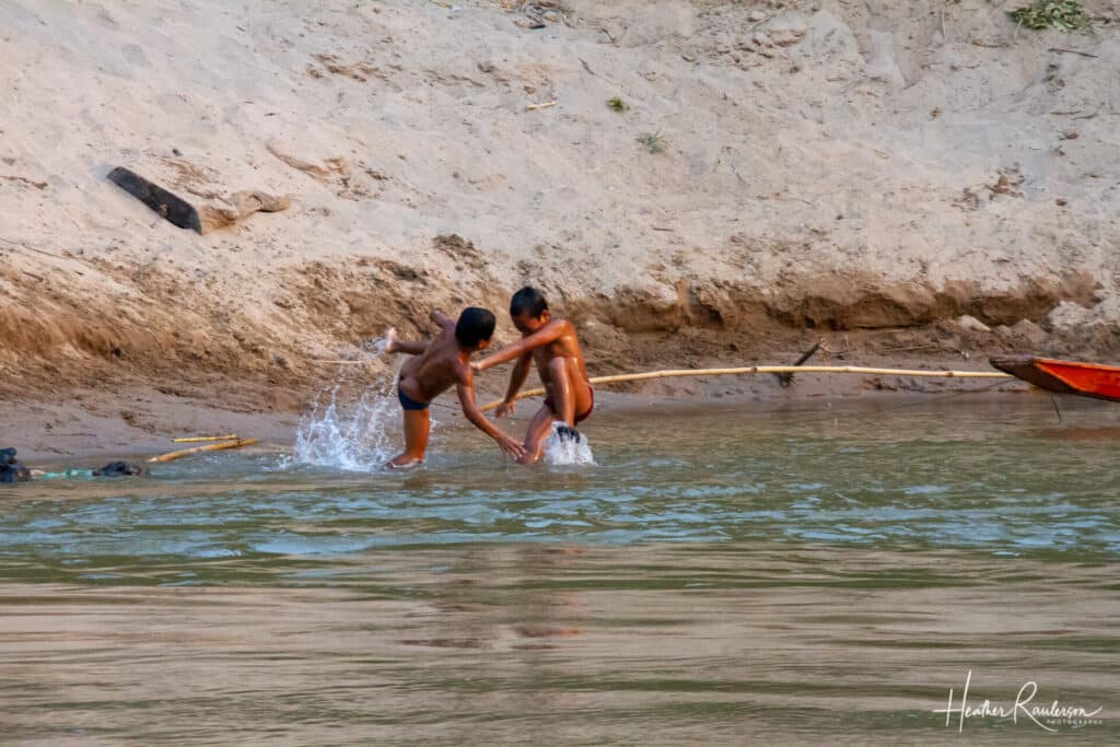 Two kids playing in the Mekong River