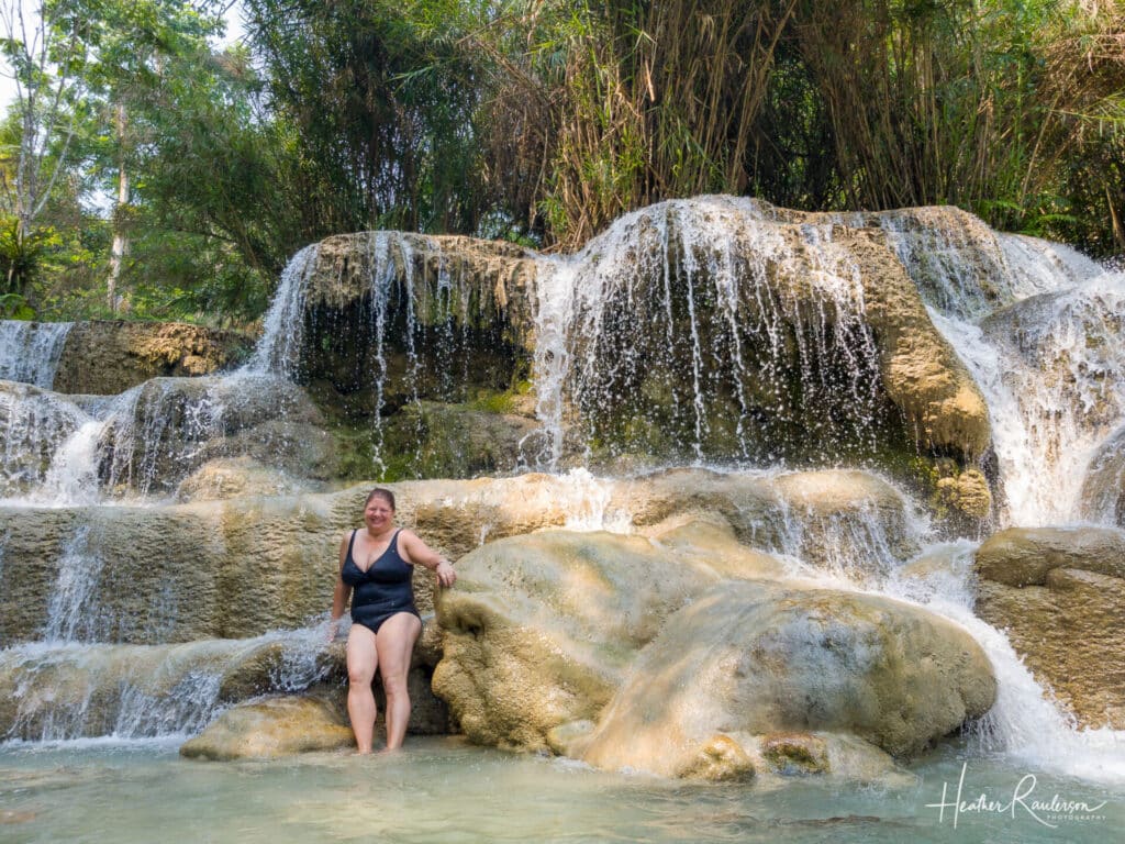 Heather posing in one of the waterfalls at Kuang Si Falls