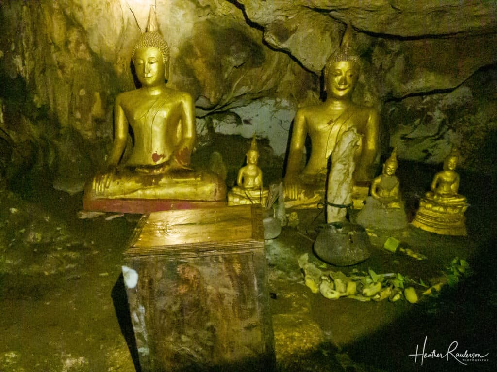 Buddha Statues Inside Phalesi Cave of Spring at Kuang Si Falls