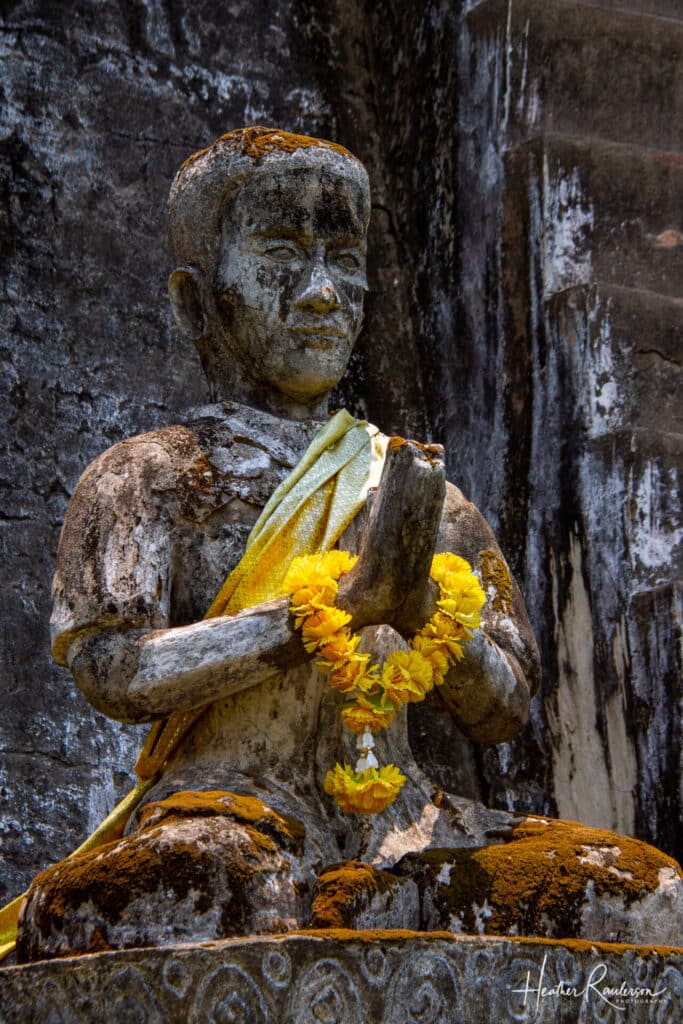 Praying Statue with Yellow Sash in Buddha Park