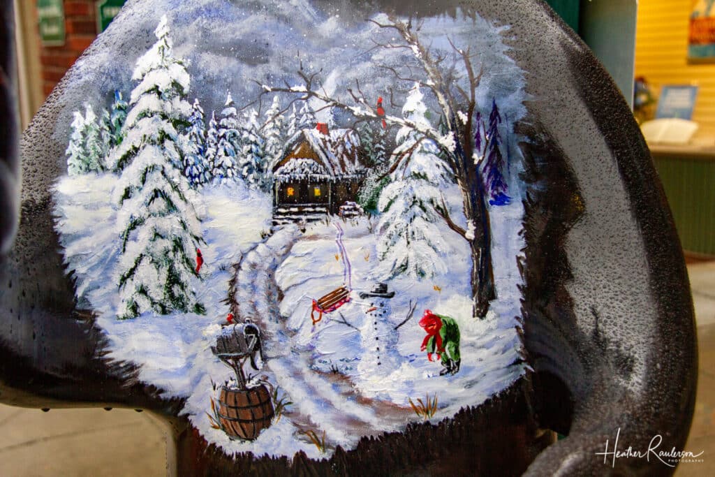 Winter scene painted on a bear in Hendersonville, NC