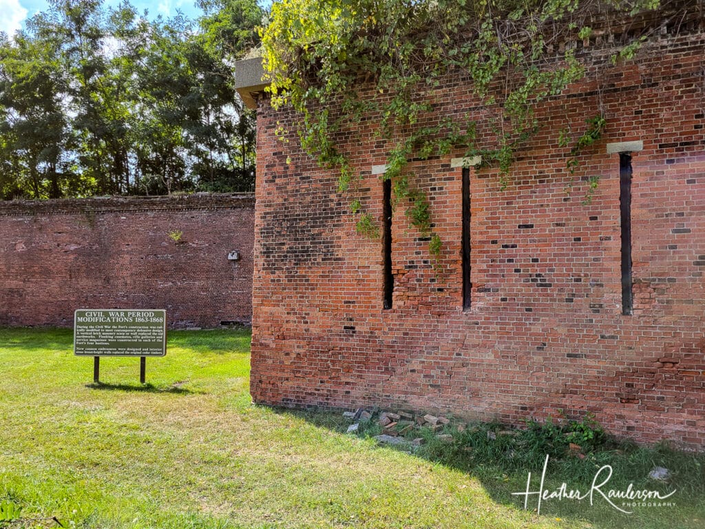 Gun turrets in the brick wall surrounding Fort Wayne