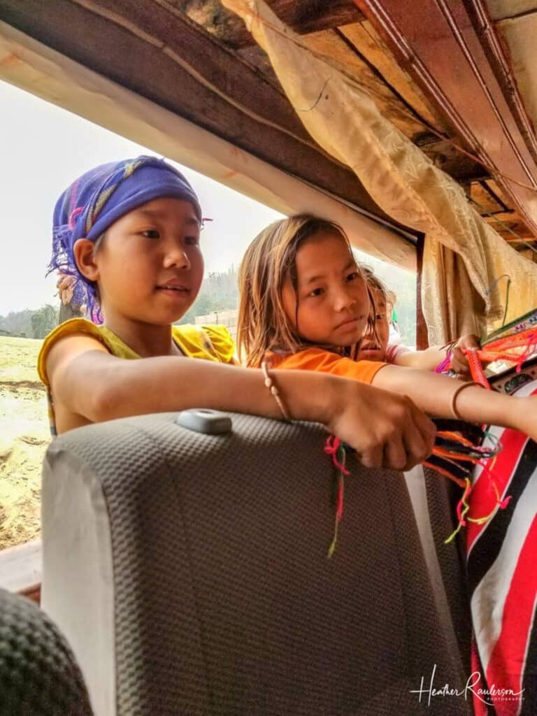 Kids selling bracelets on the Mekong River stops