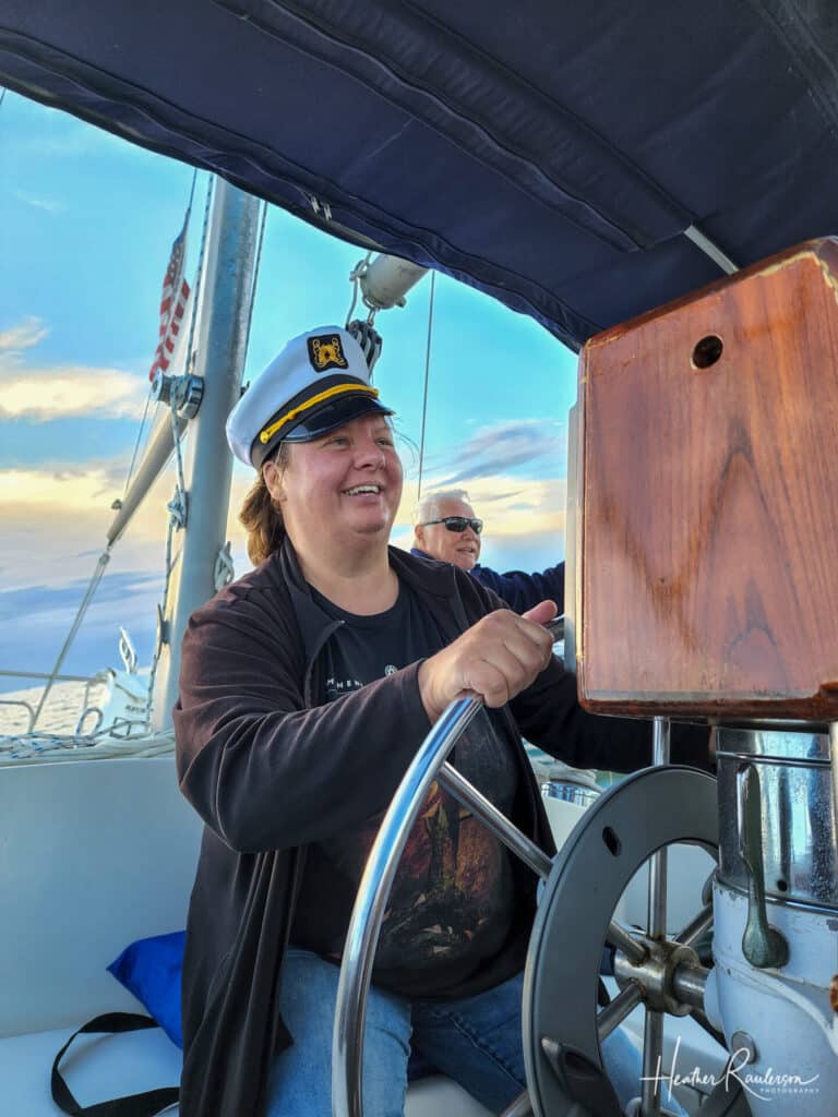Heather at the helm on the Sea'scape